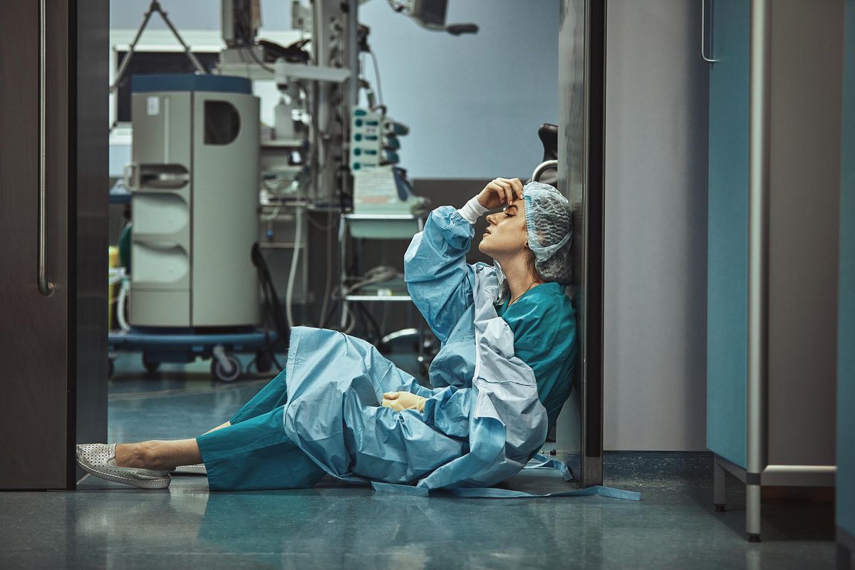oman surgeon looking fatigued after surgery