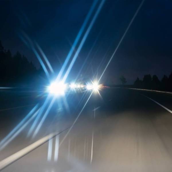 oncoming cars on highway in twilight time