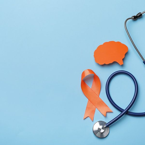 Orange ribbon, stethoscope and paper brain cutout, Multiple sclerosis awareness