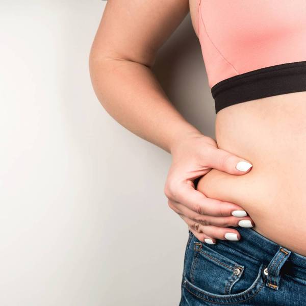 Overweight woman in jeans