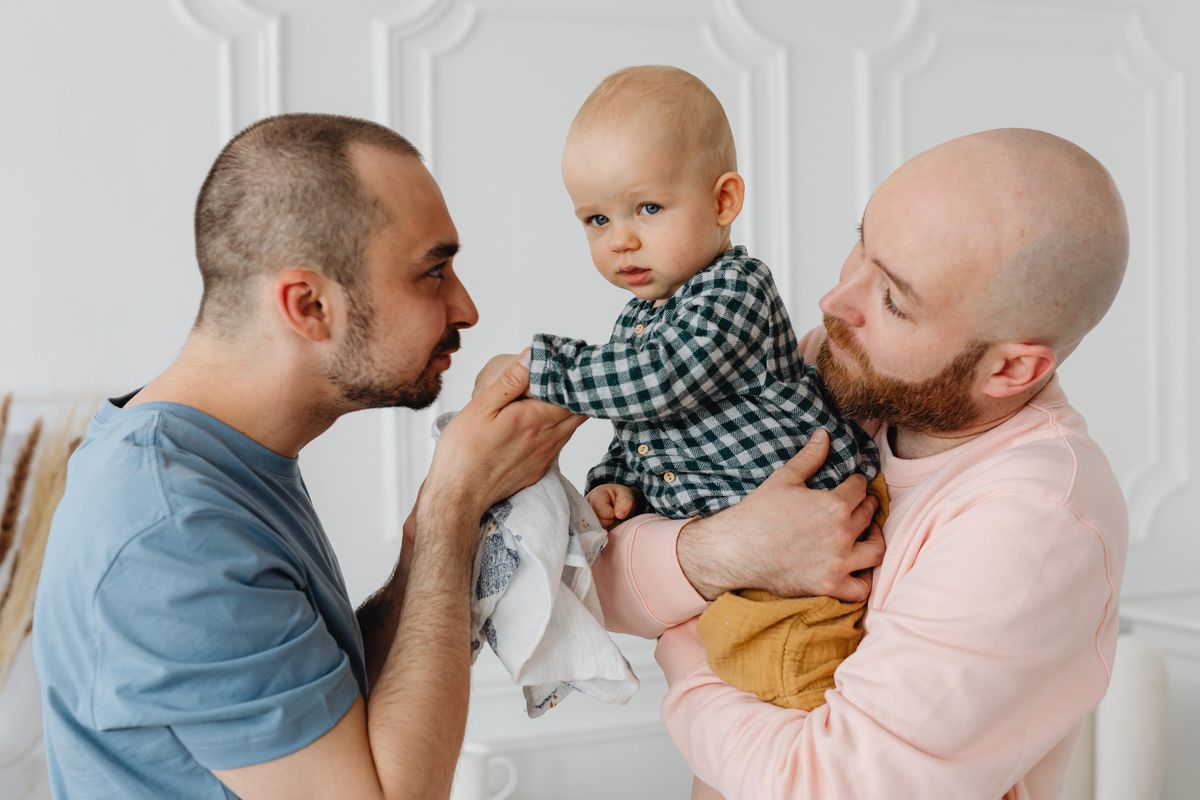parents holding their baby