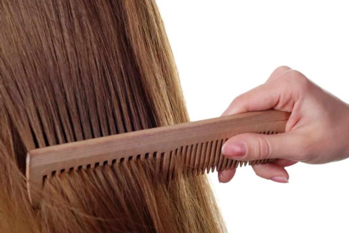 person combing hair