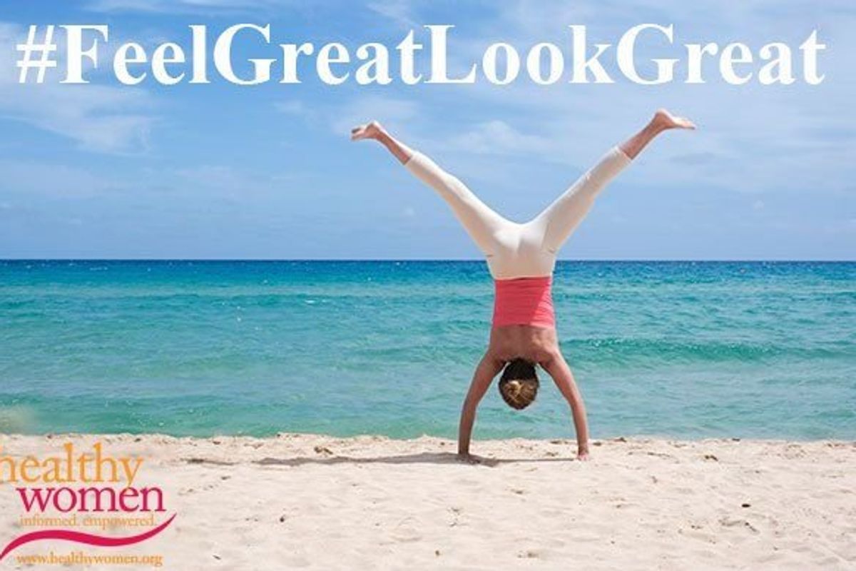 person doing a cartwheel on the beach