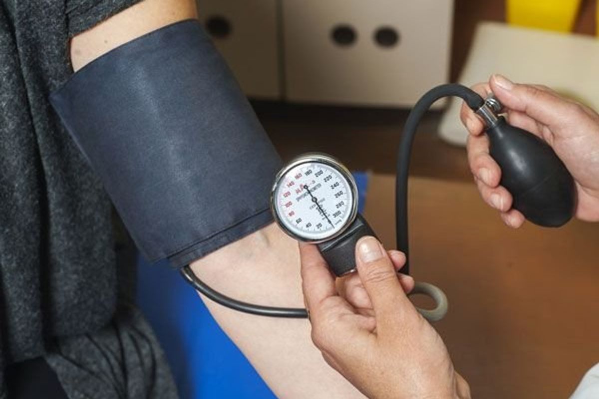 person getting their blood pressure taken
