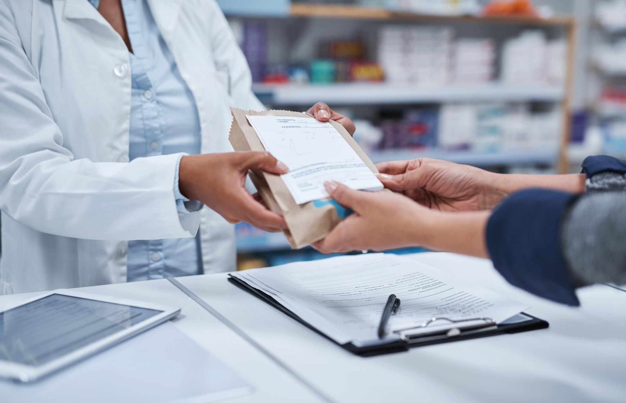 pharmacist assisting a customer