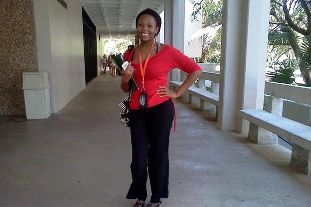 photo of crystal jackson standing in an outdoor hallway