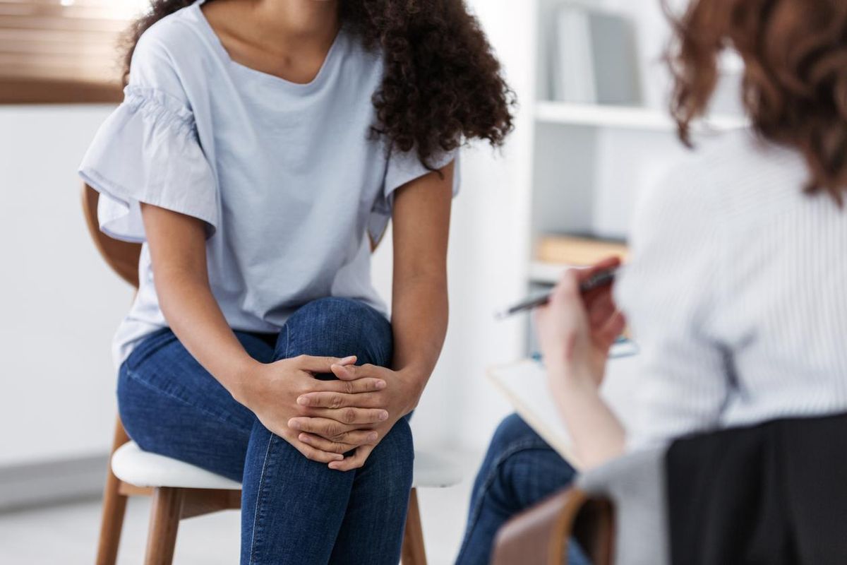 photo of two women during group psychotherapy