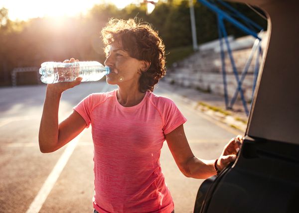 Photo of woman drinking water