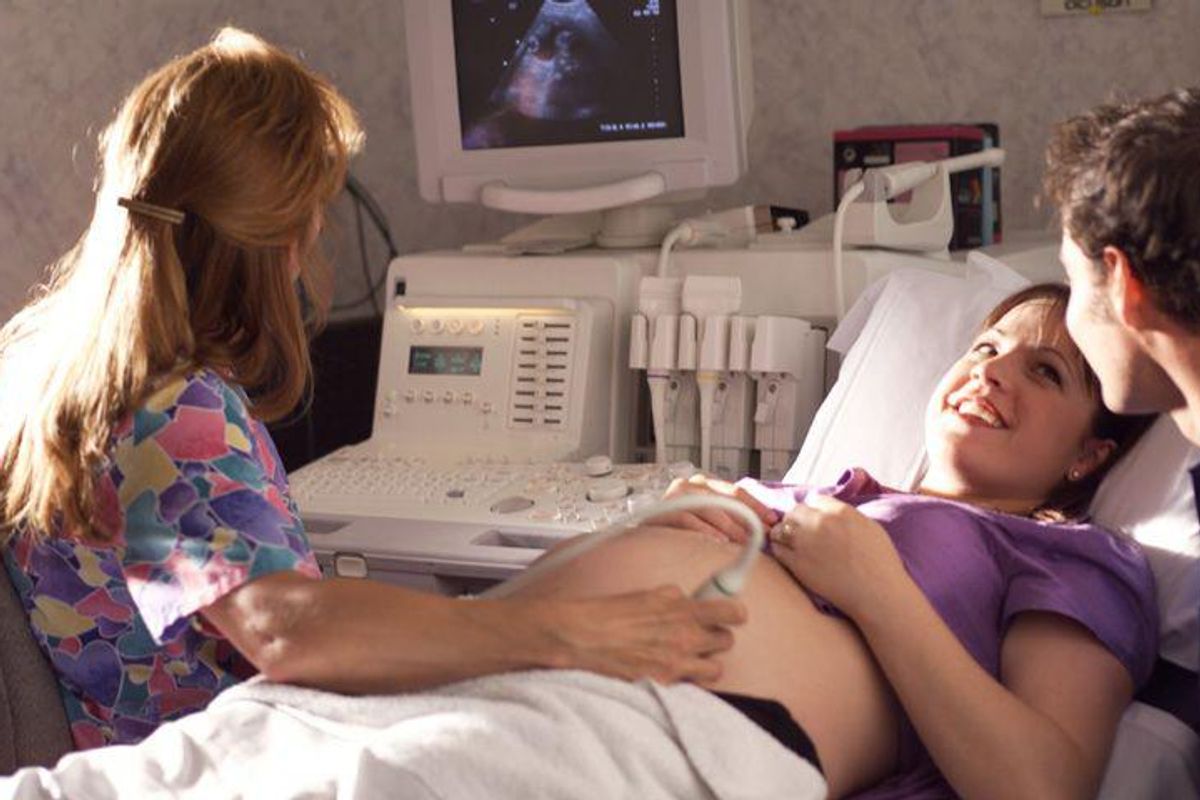 pregnant couple getting an ultrasound