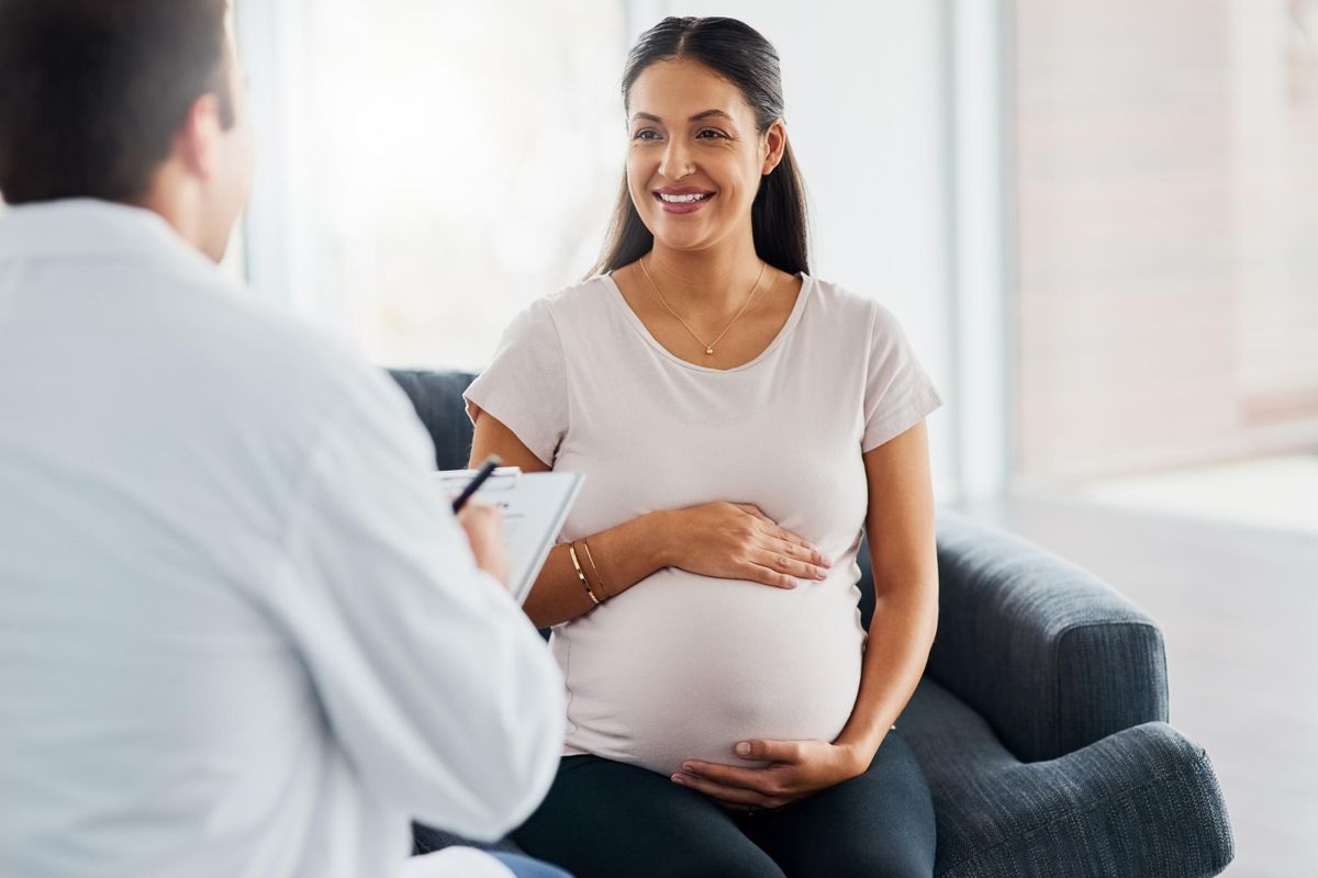 pregnant woman having a consultation with her doctor about maternal health