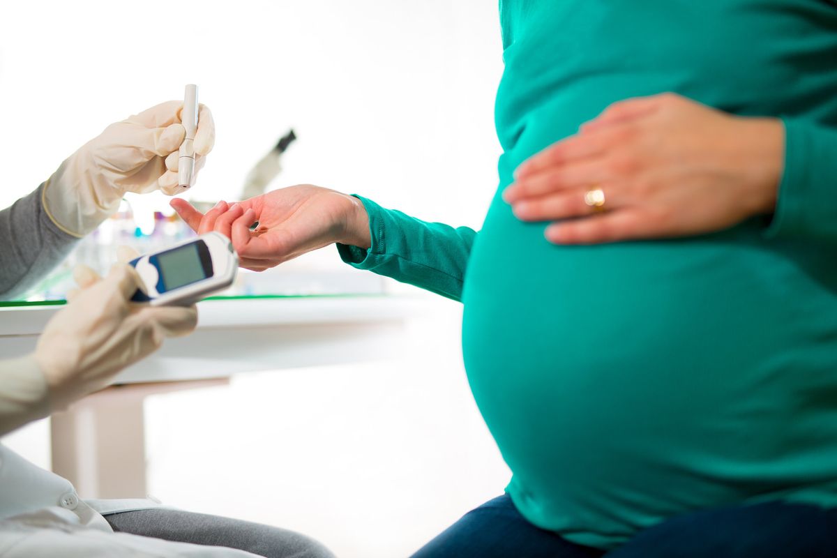 pregnant woman having her blood sugar/ glucose checked for Gestational Diabetes