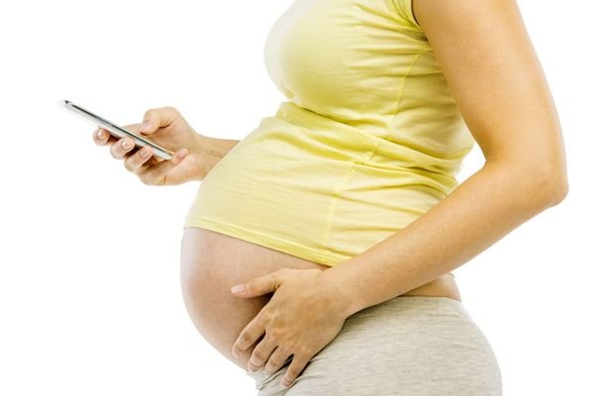 pregnant woman on her cell phone