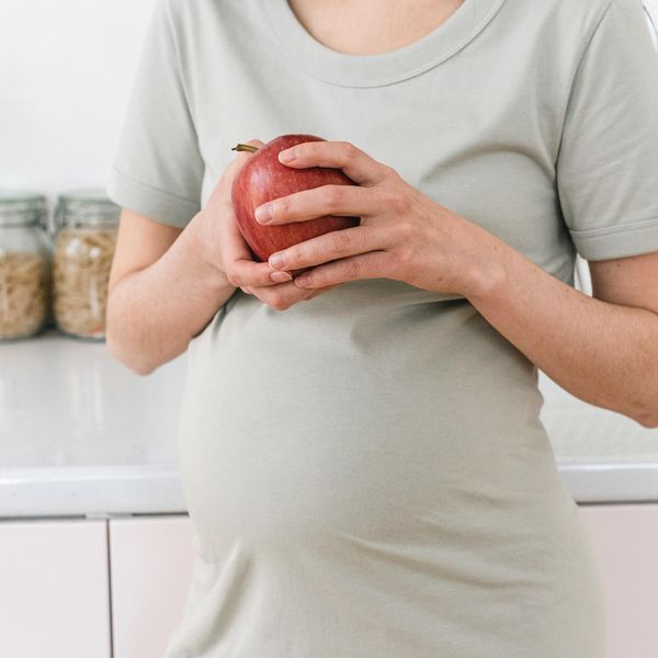 pregnant woman with apple