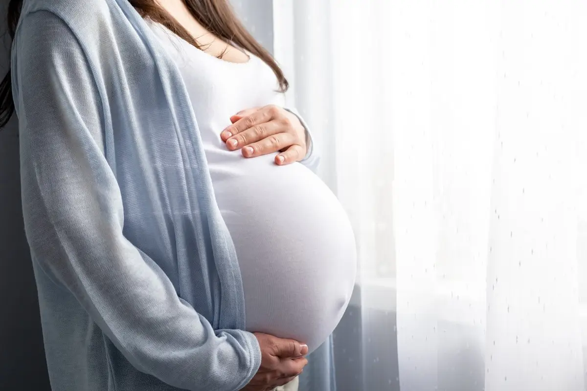 pregnant woman with big belly advanced pregnancy in hands