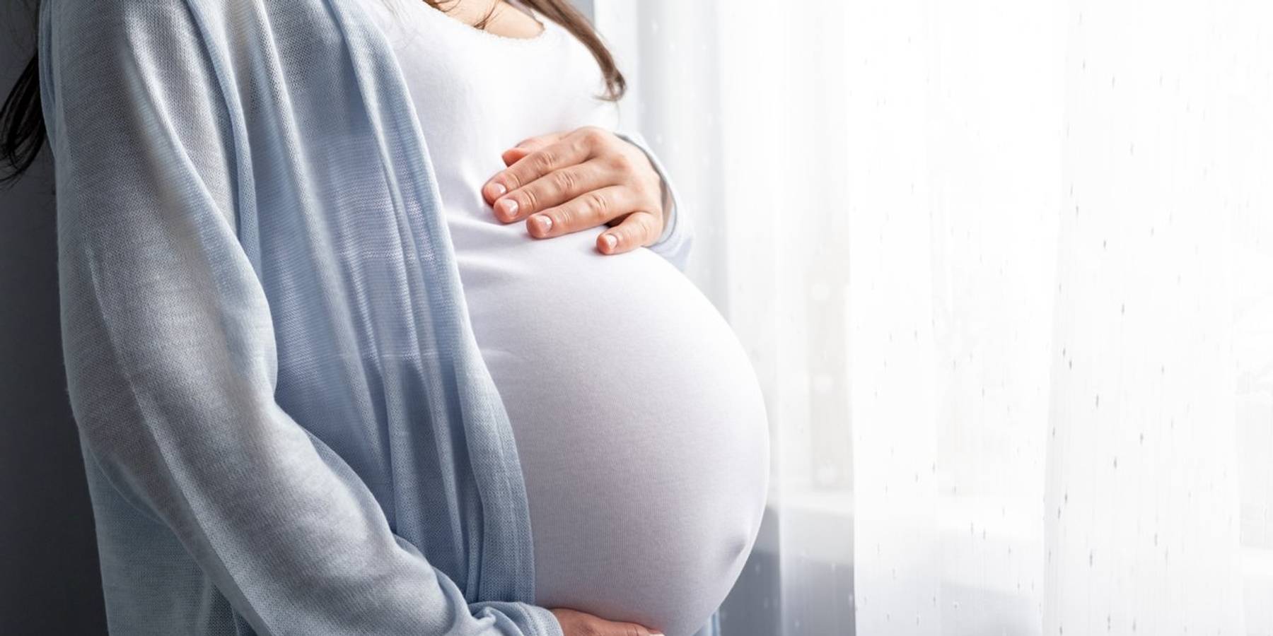 pregnant woman with big belly advanced pregnancy in hands