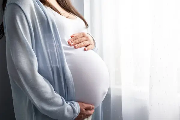 pregnant woman with big belly advanced pregnancy in hands