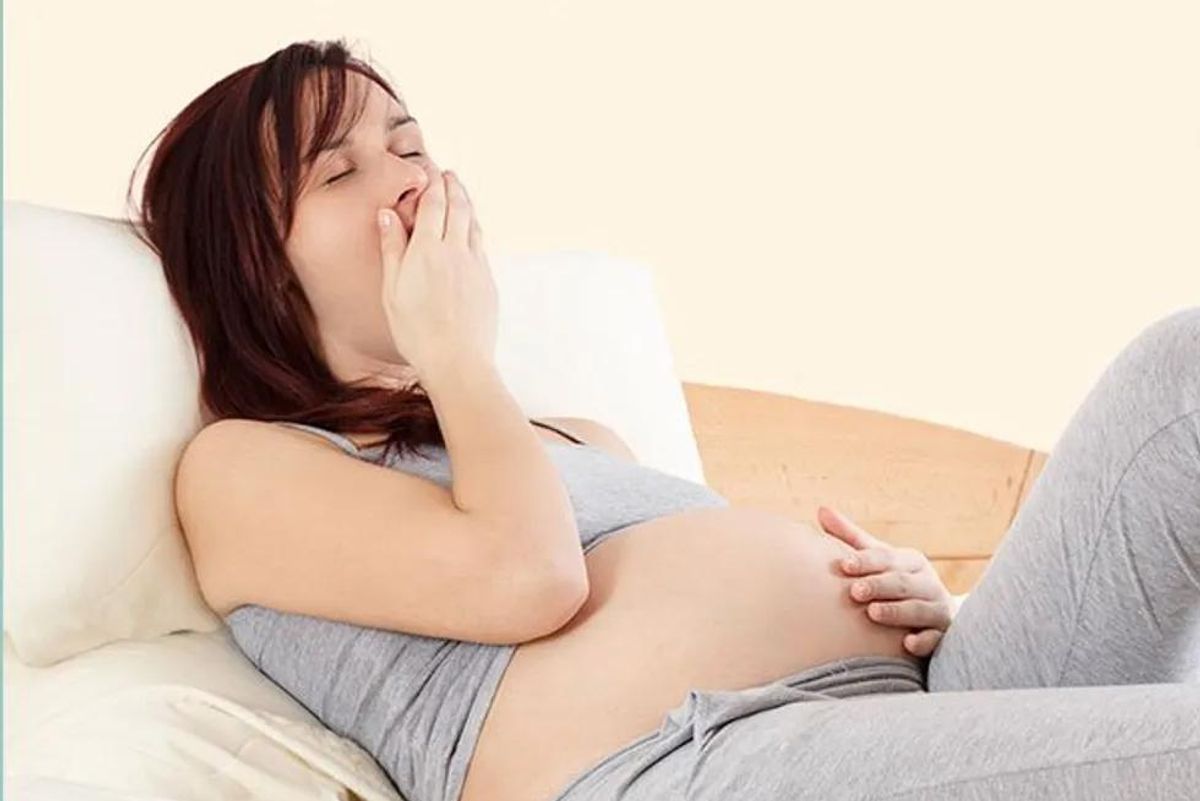 pregnant woman yawning