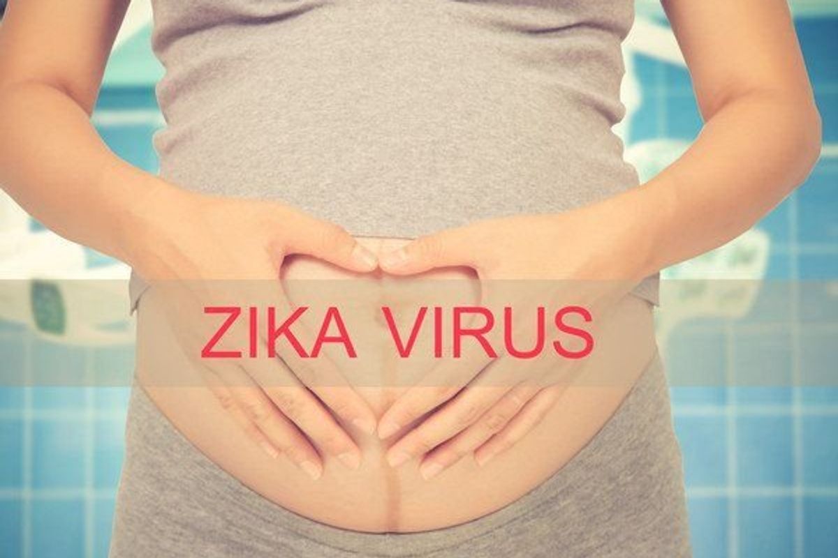 pregnant woman zika virus written across her stomach