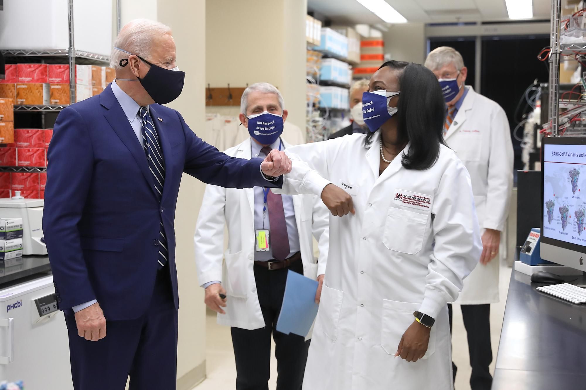 President Biden and Dr. Anthony Fauci visit Corbett in her lab, 2021 