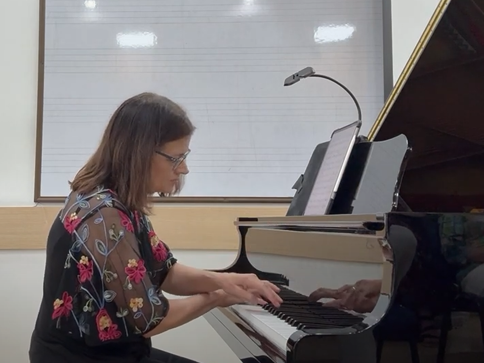 Rebecca playing the piano