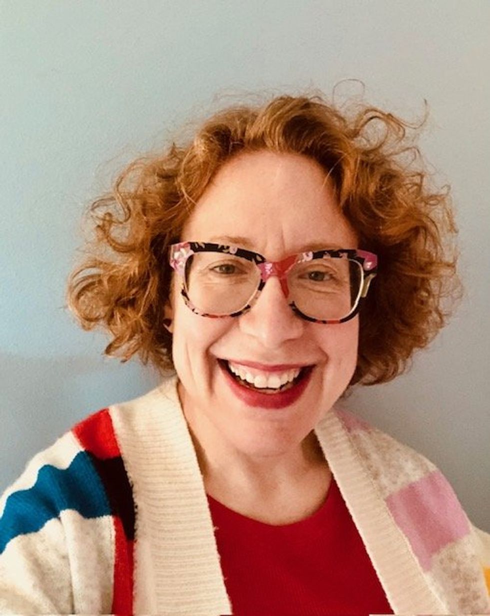 Rebecca Sager, rocking her red locks, 2023