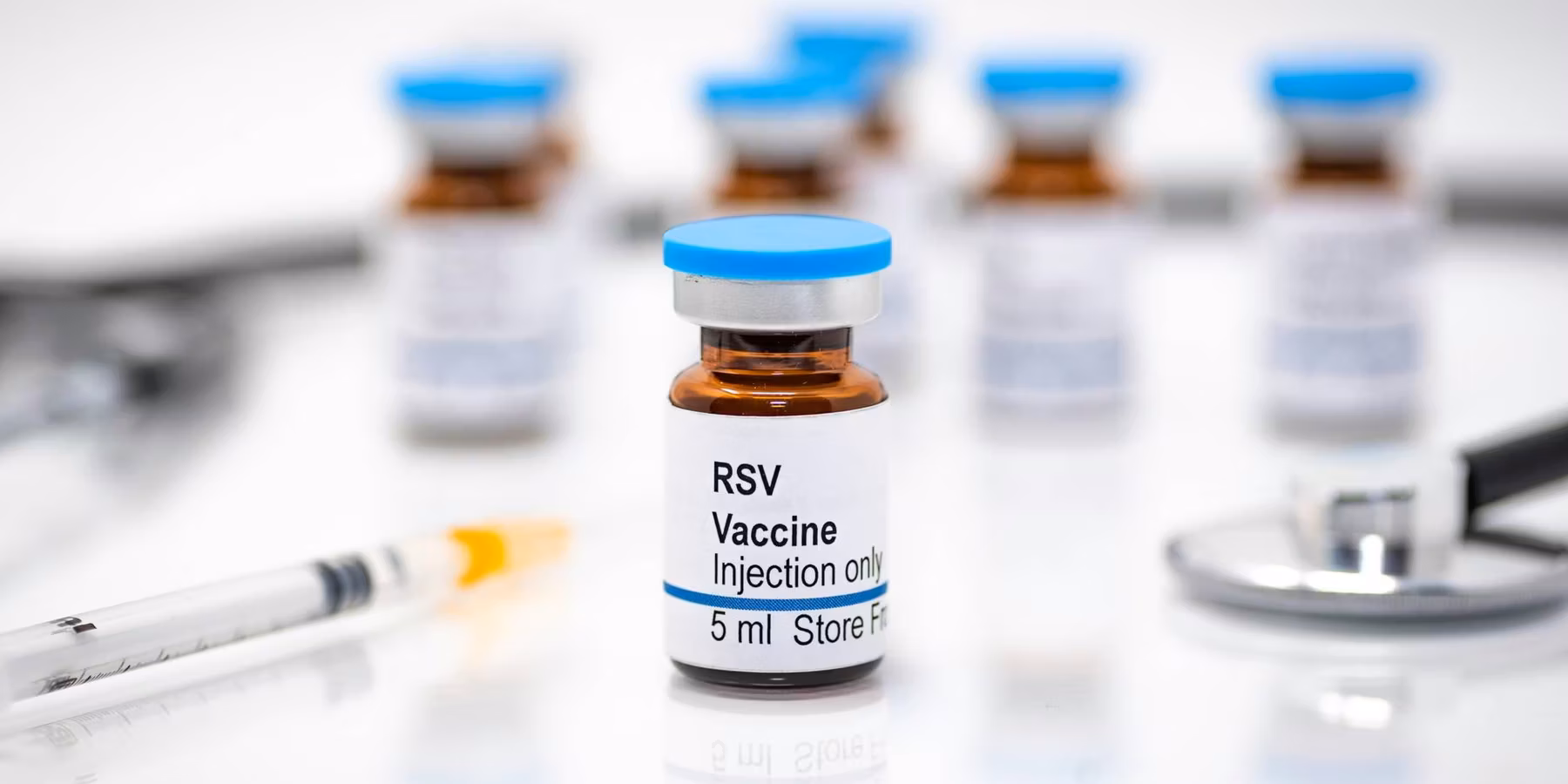Respiratory syncytial virus RSV vaccine vial with syringe and stethoscope