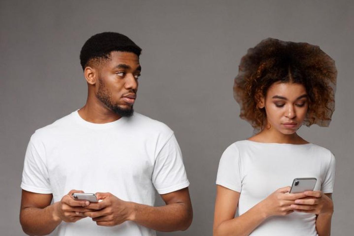 Sad black man looking at his girlfriend