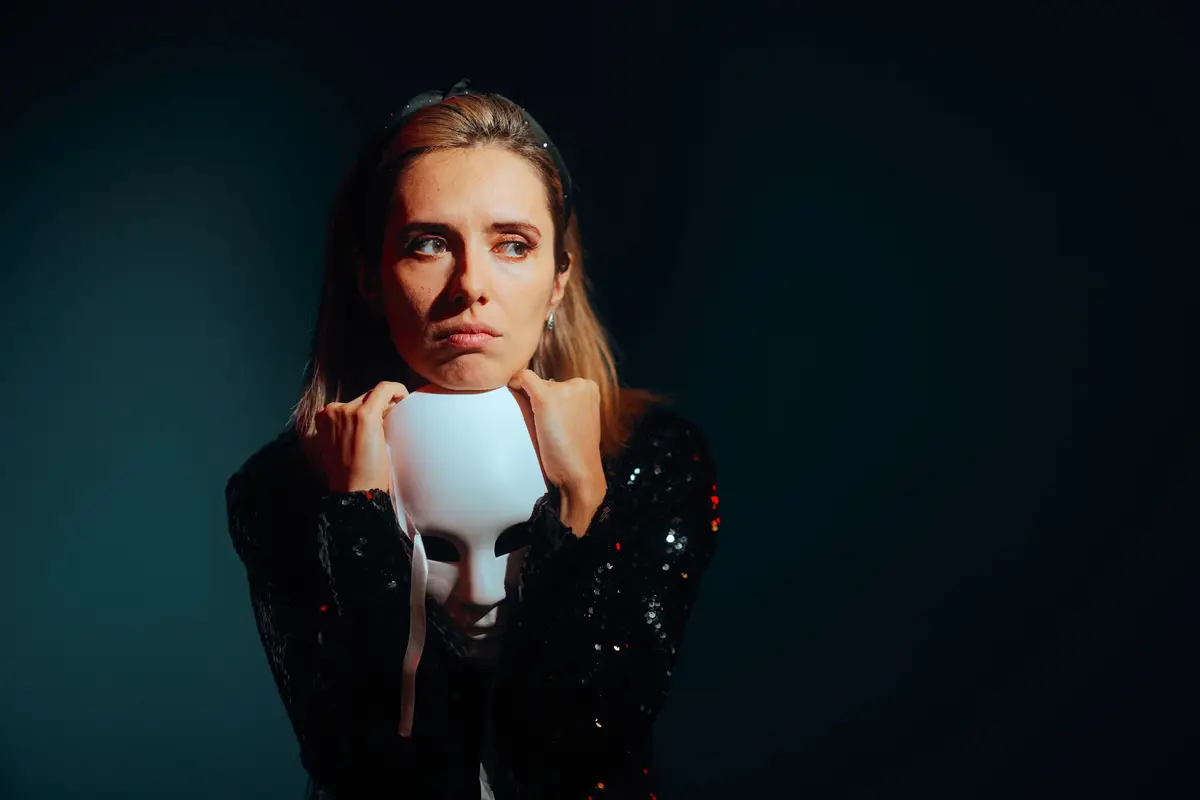 Sad Woman Holding a Theater Mask Feeling Depressed