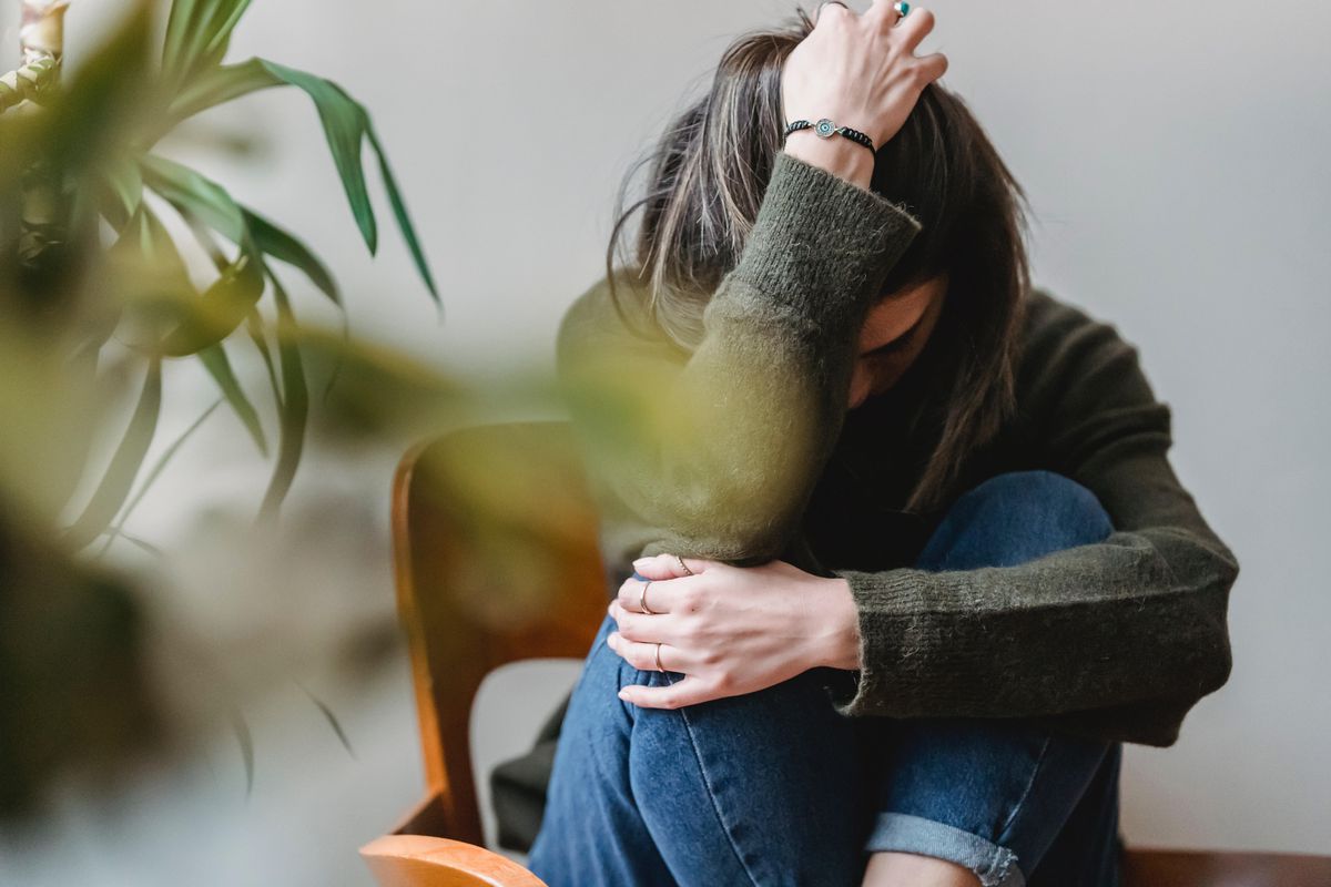 sad woman sitting in a chair