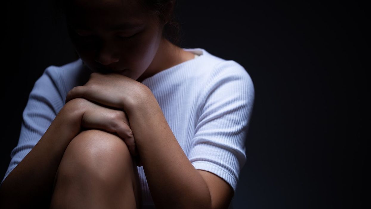 Sadness of a woman in the dark