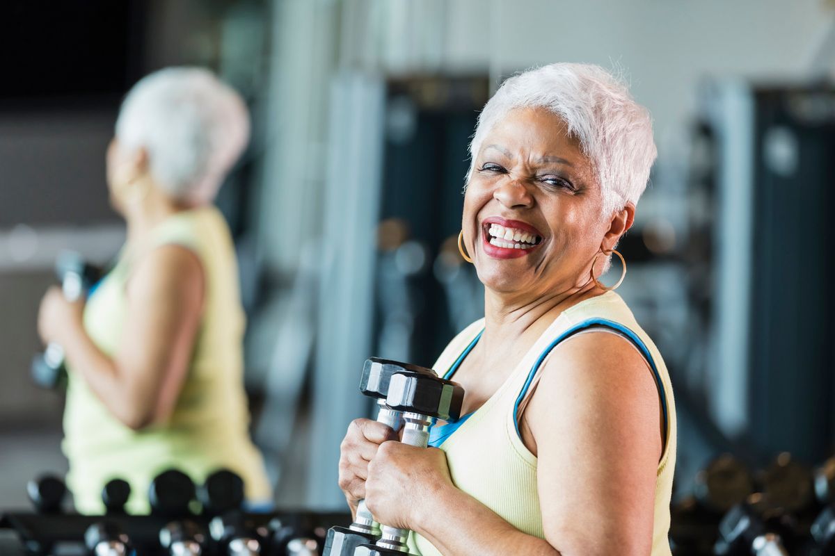 senior African-American woman in her 60s working out at the gym