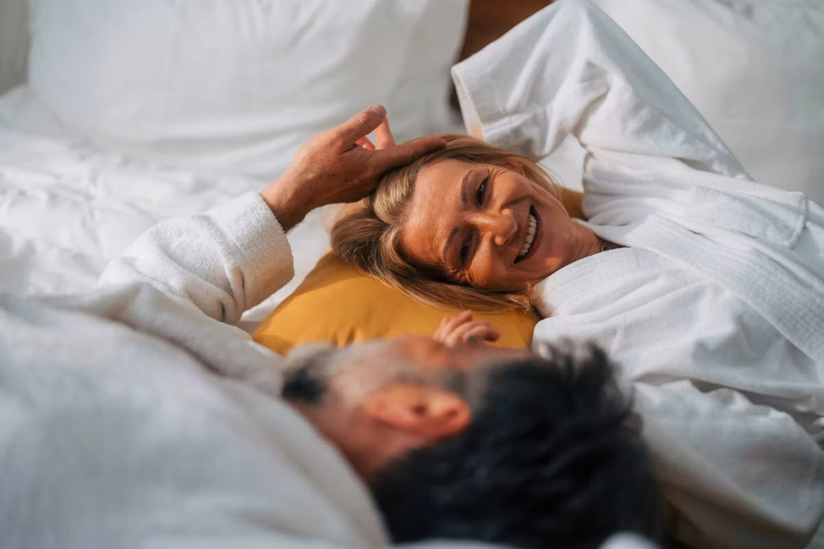 Senior couple sharing an intimate moment in bed