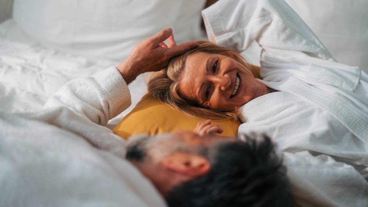 Senior couple sharing an intimate moment in bed