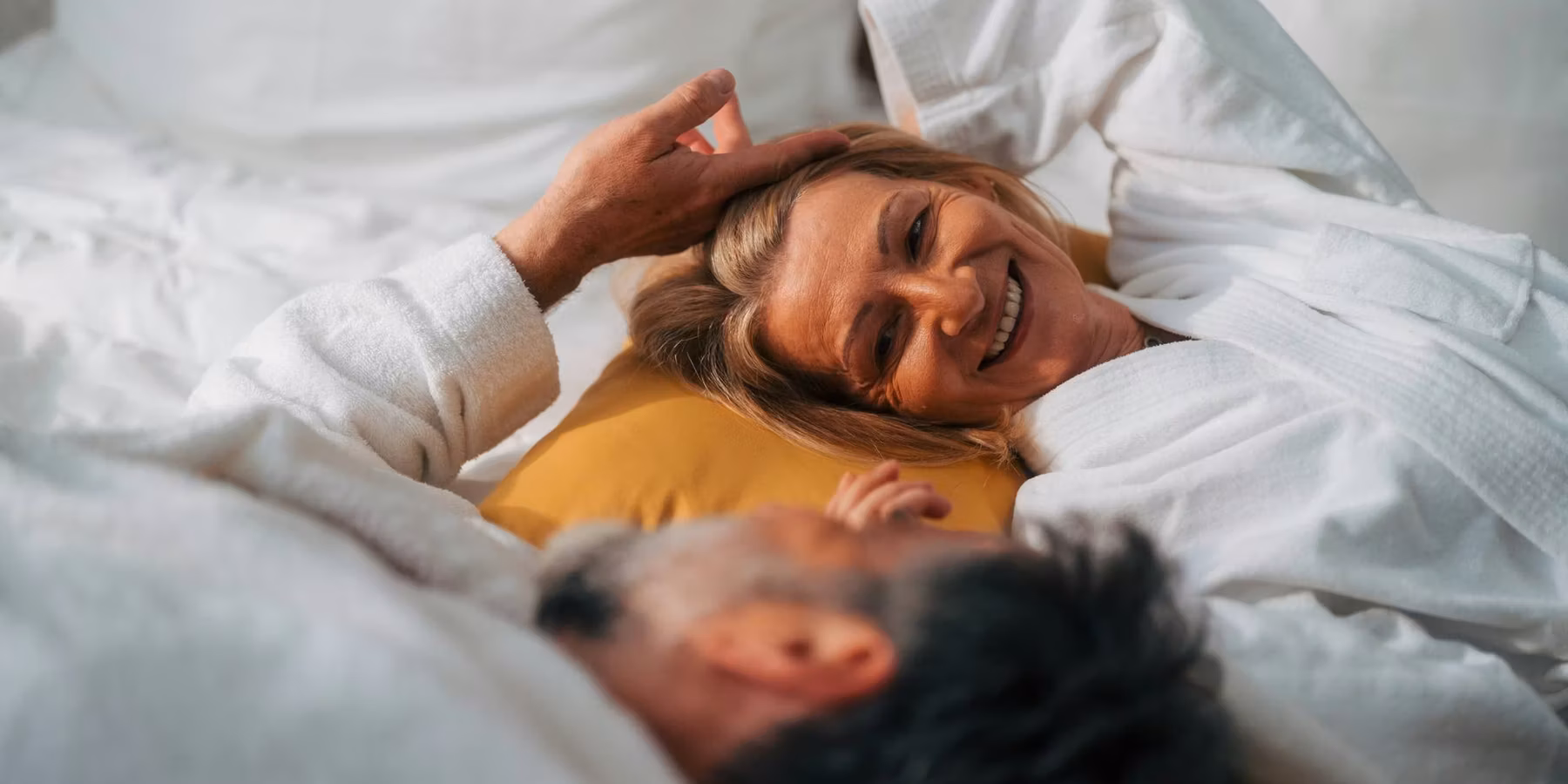 Senior couple sharing an intimate moment in bed