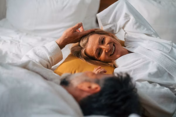 Senior couple sharing an intimate moment in bed