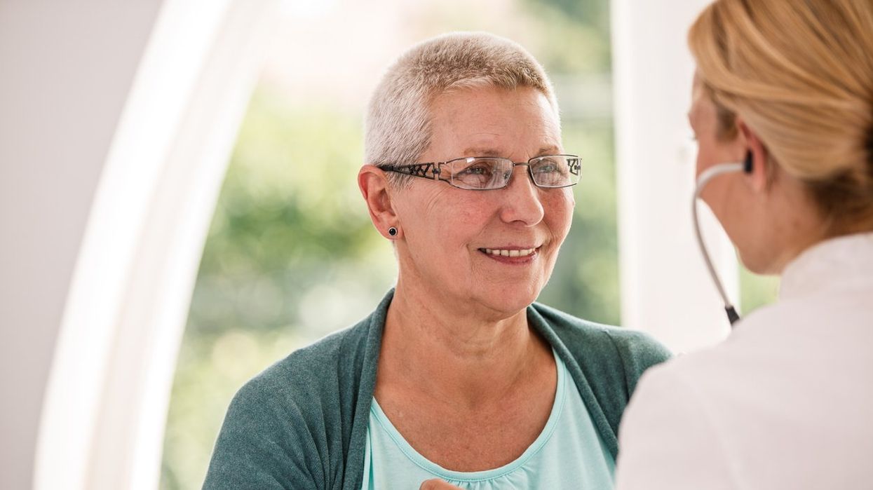senior woman receiving medical examination at doctor's office.