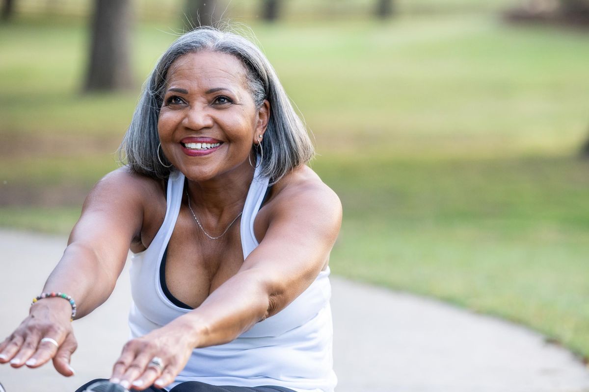 senior woman stretching before work out