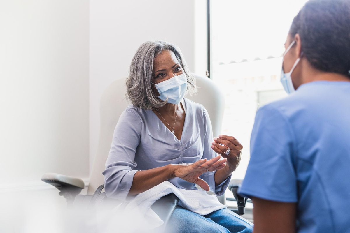 Senior woman talks with female healthcare professional about Diabetes and Cardiovascular Disease