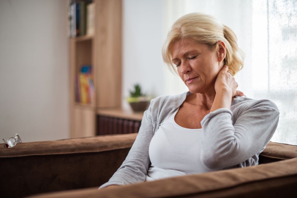 senior woman with Chronic Fatigue Syndrome sitting in a living room
