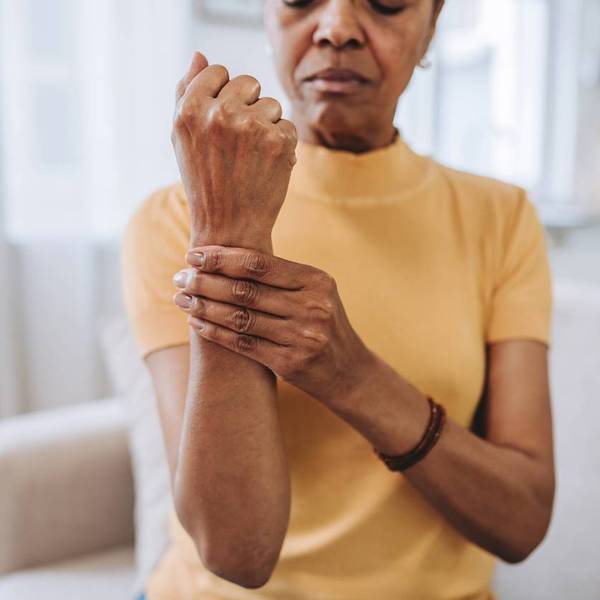 Senior woman with wrist pain at home