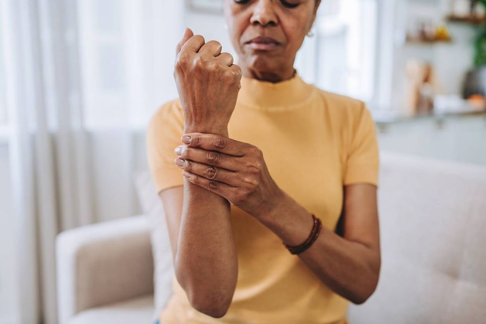 senior woman with wrist pain at home