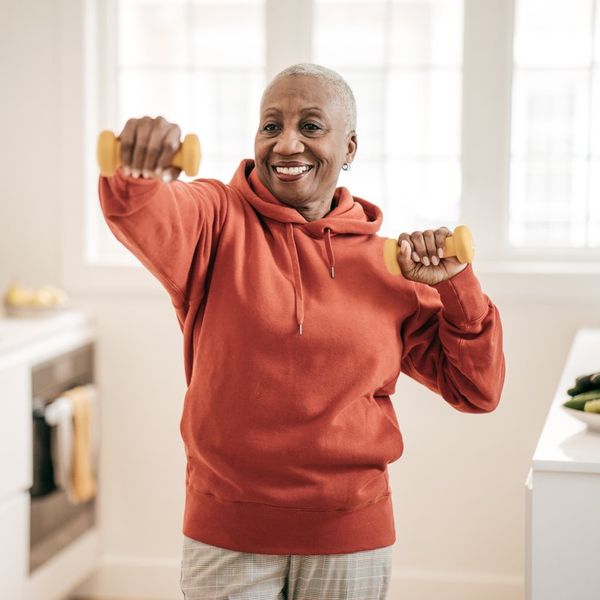 Senior women exercising at home
