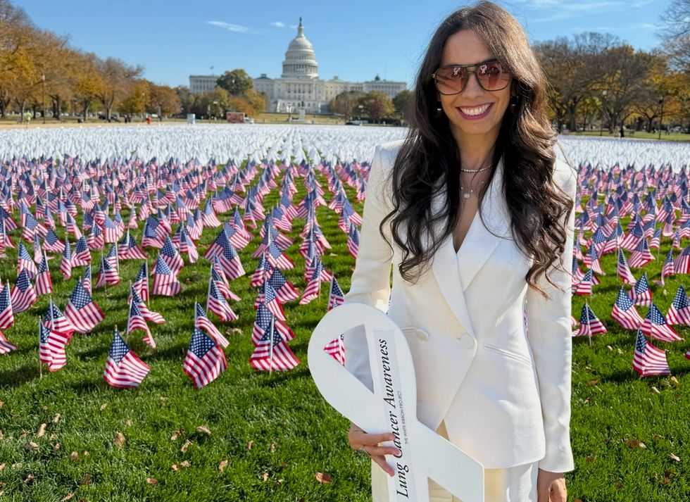 shira holding a sign for lung cancer awareness