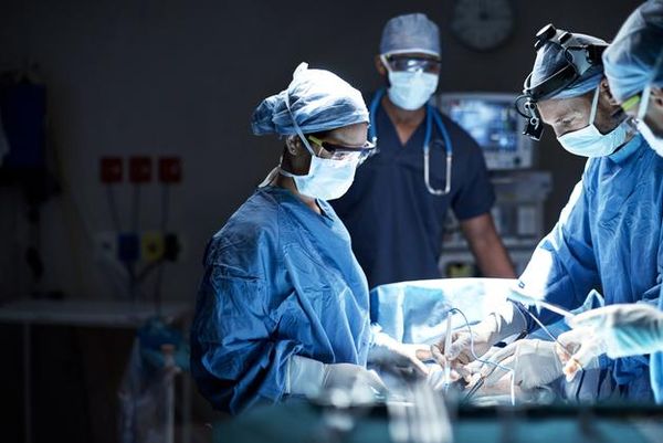 Shot of a team of surgeons performing a surgery in an operating room