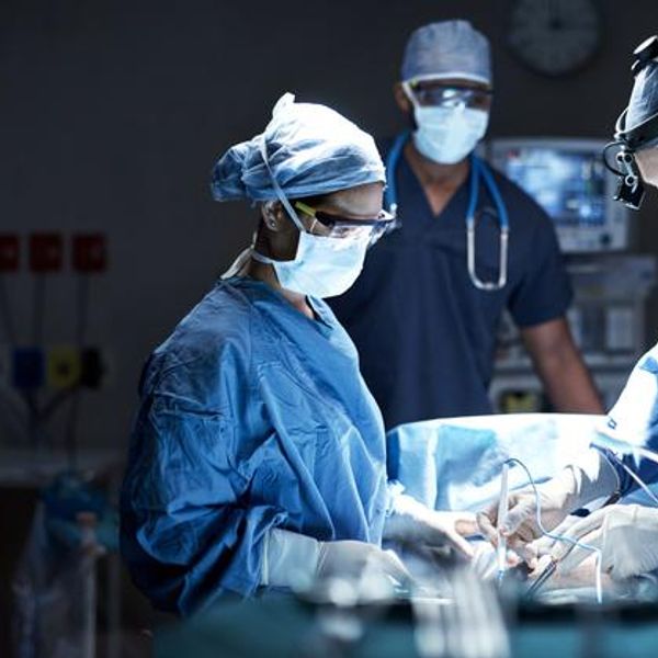 Shot of a team of surgeons performing a surgery in an operating room