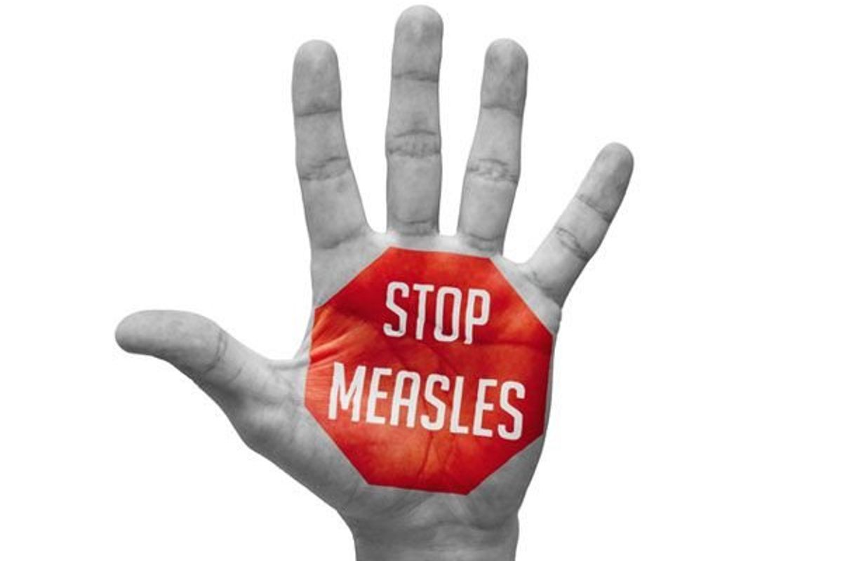 sign that says stop measles