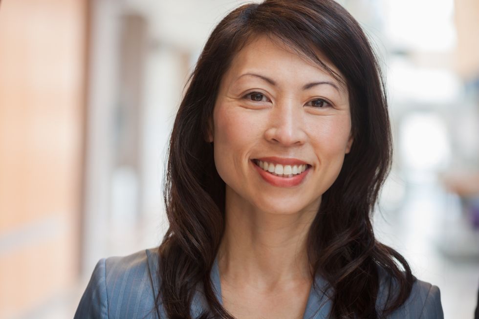 smiling woman in her 40s