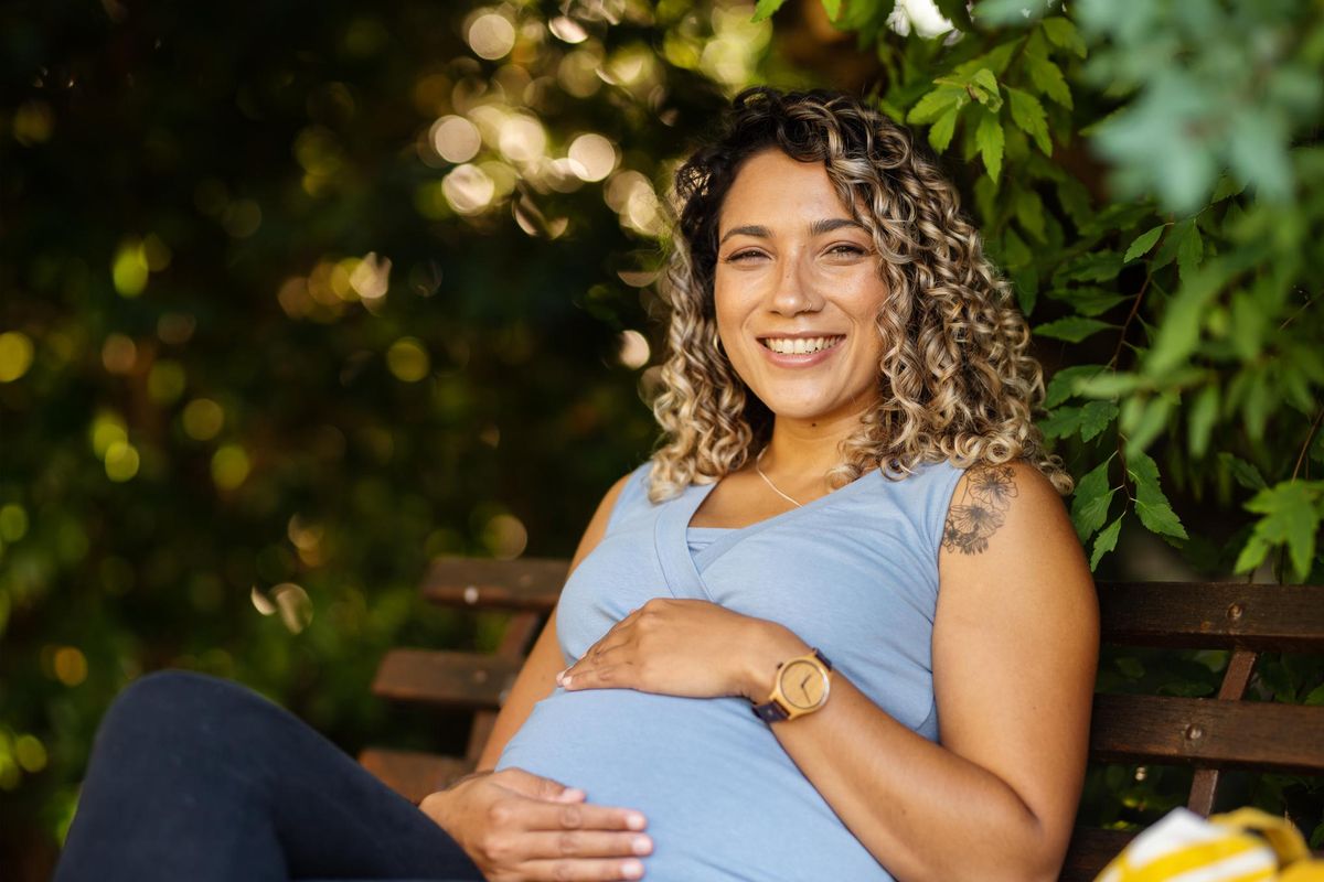 Smiling young pregnant woman