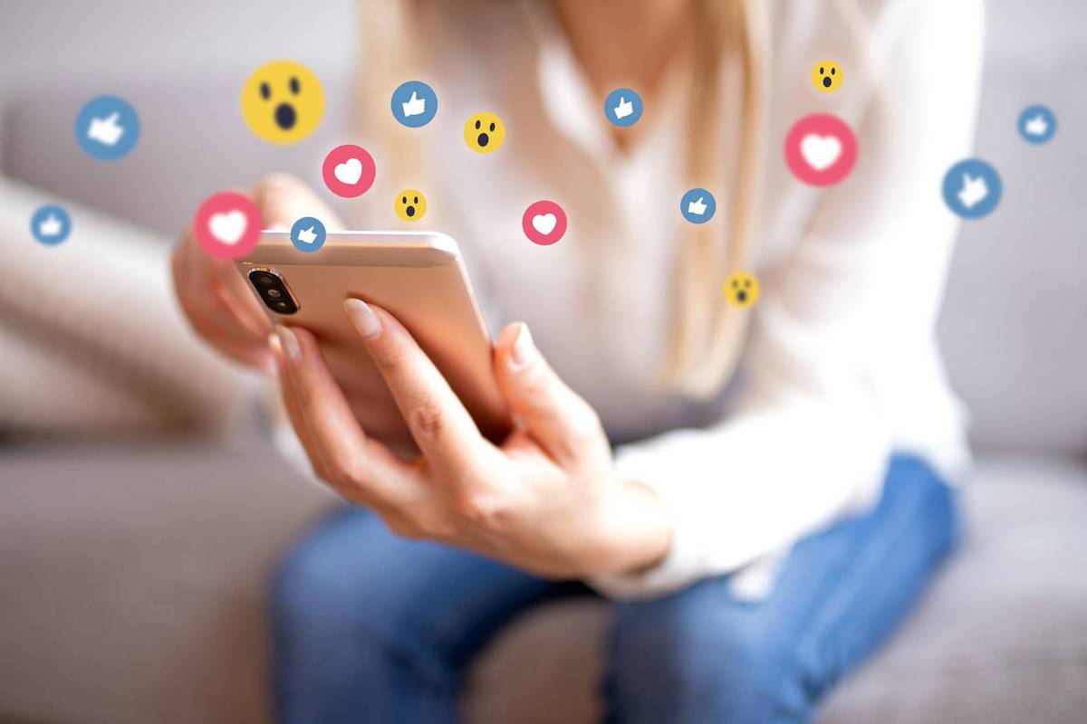 Smiling young woman with mobile phone Surfing the internet