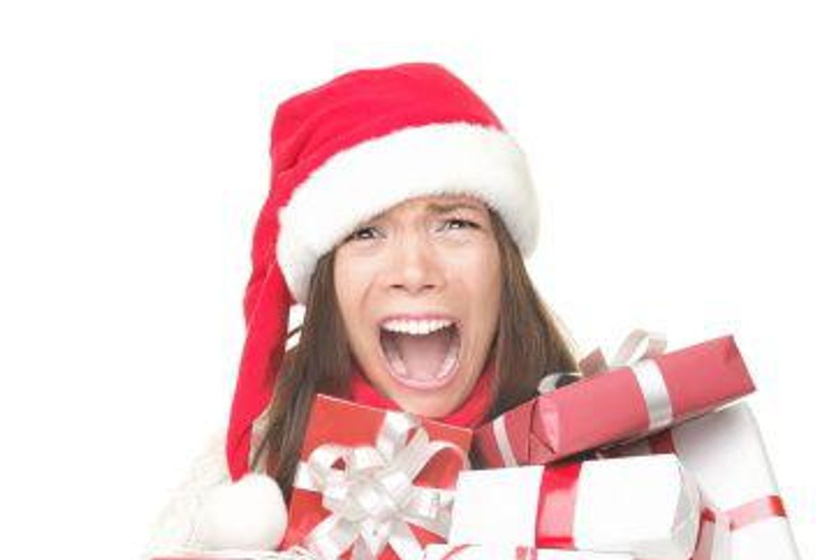 stressed woman holding presents